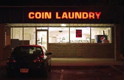 Illuminated coin laundry storefront